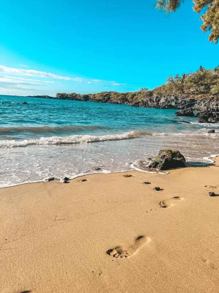Footprints on a beach walk in Hawaii