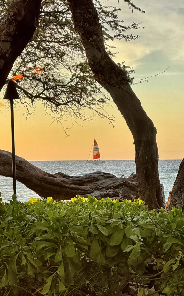 sailboat at sunset in the perfect Big Island itinerary